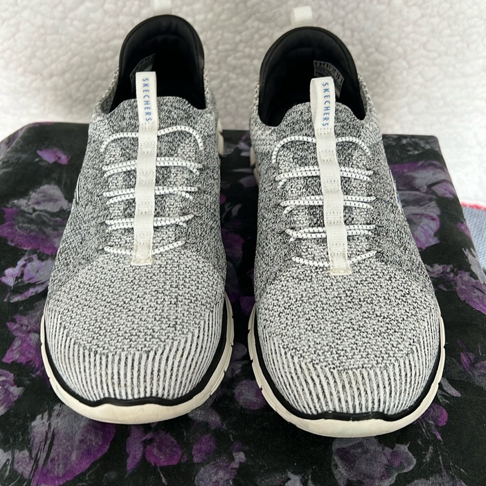 Women’s size 9 Skechers Slip On Sport Sneaker black/white good condition.